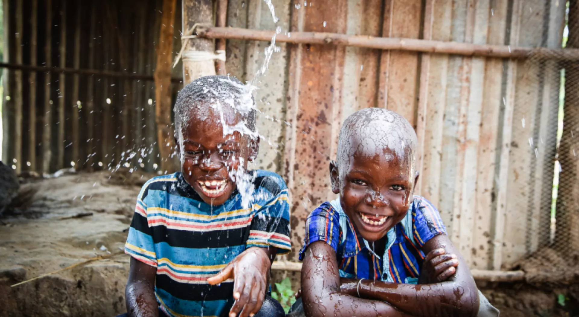 African children playing with water