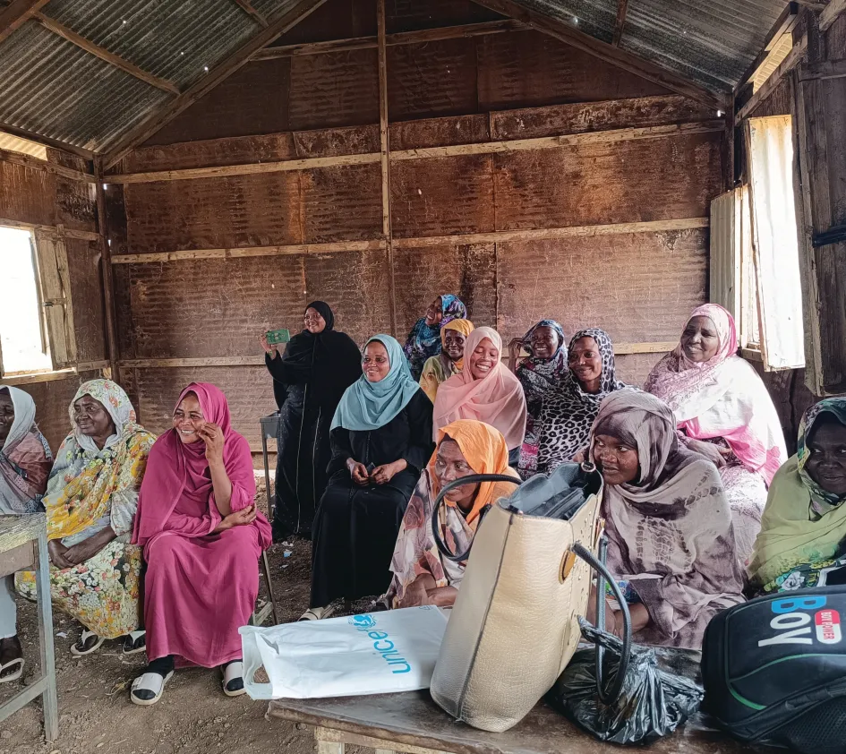 Women farmers discussing stories