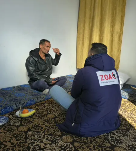 Husni and a ZOA employee