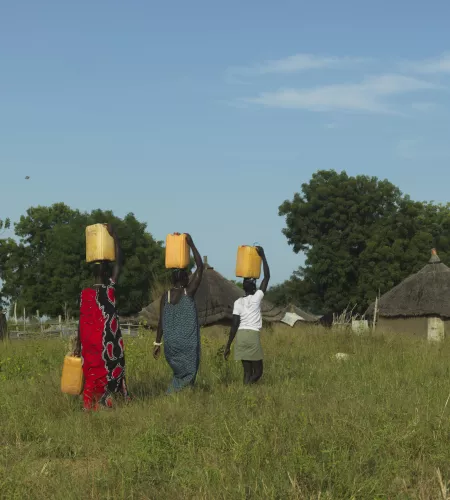 Woman carrying water in South Sudan