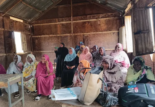 Women farmers discussing stories
